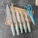 A set of kitchen knives on a stand, 6 objects: 5 knives 8.5 cm, 12 cm, 12 cm, 19.7 cm, 19 cm, scissors, blue color