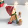 Polystone souvenir "Baby in a red hat and green scarf sits" 12.5x12x12.5 cm