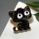 Brooch "Kit" with big eyes, black color in gold