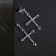 Earrings with rhinestones “crosses” inserts, white color in silver
