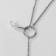 The pendant "Aesthetics" on the ring, the color is white in silver, l = 76 cm