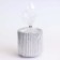 A candle in a candlelight made of gypsum with narrow faces, 7x8cm, silver