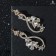Earrings with “evening” rhinestones, rounded, white color in gold