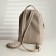 A backpack with a zipper, Textura, external pocket, light-beige color