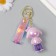 A keychain plastic, rubber with a carbine, a "girl in pink" 3x4.2x7 cm strap