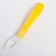 A spoon for nursery for feeding silicone, from 5 months, yellow color