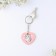 The gift set “Kus is for love”, badge + keychain, 8.3 x 12 cm.