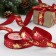 A satin tape with embossing "Deer in the harness", 25 mm, 23 ± 1 m, red color/gold No. 33