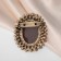 Brooch "Kame" in rhinestones, brown color in black gold