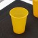 A glass of plastic disposable "pugs", 200 ml, yellow color
