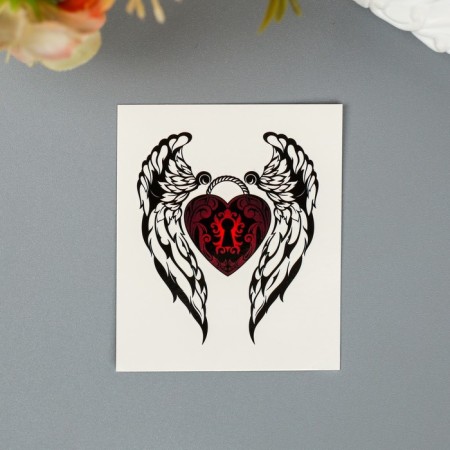 Tattoo on the body "Wings with a red heart"