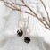 Hanging earrings with rhinestones "drop with a rhombus", black color in pink gold, 7.2 cm