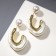 Earrings with pearls "flow" bead, white color in gold