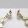 Earrings Assorted "Flowers" in crosses, white color in gold