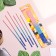 A set of candles in the cake, 6 pieces "Happy", 17 cm, pink with blue