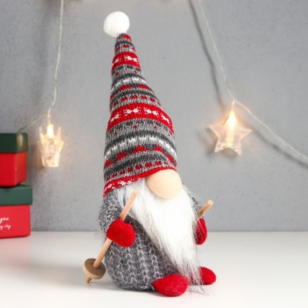 Interior doll "Santa Claus with ski sticks, a gray cap with patterns" 27x12x8 cm-1