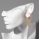 Earrings hanging "disk" with chains, white color in gold