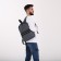 A backpack with a zipper, "saxi", outer pocket, dark gray color
