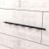 Holder for storing a hand tool with smooth handles, wall, black