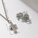 Set 2 objects: earrings, pendant "cross", color black silver, 43 cm