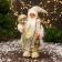 Santa Claus "with bows on shoes and with a flashlight" 30 cm, golden-white