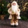 Santa Claus "in a fluffy fur coat, cap, with a gift" 47 cm, white-golden