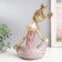 Polystone souvenir "Baby with two tails" gold with pink 21x13.5x26 cm