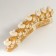 Polystone souvenir "Seven white elephants in golden blankets on a carved tusk" 11x3.5x28.5 cm
