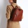 Women's backpack made of artificial leather with lightning, 2 pockets, brown color