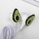 Headphones and hair gum on the postcard "Avocado", 10.3 x 14.5 cm