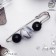 Planet pin 7 cm, black and white color in silver