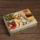 The box is folding, the cover is “Happy New Year” 24 x 17 x 8 cm