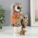 Polystone souvenir "Gray eagle owl with brown wings, with a stump of hemp" 16.8x9.5x5 cm