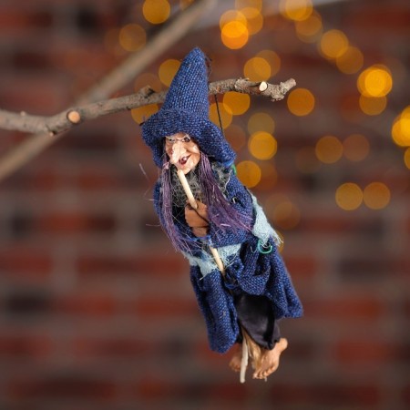 Baba - Yaga in rags, with a broom, hanging, mix