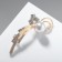 Brooch "Curl" radiance, white color in gold