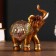 Polystone souvenir "African elephant in the gold, openwork blanket" MIX 12x11x4.7 cm