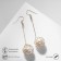 Hanging earrings “wandered ball”, white color in gold, 6.5 cm