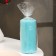 Candle-cylinder with faces, 5x10 cm, turquoise, 6 hours
