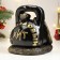 The piggy bank "Snake with weights" is black, 25 cm