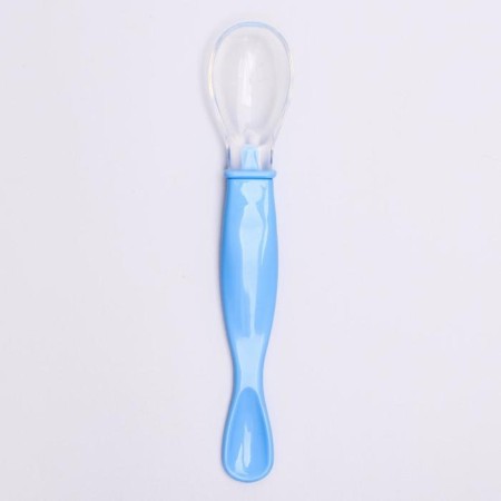 A spoon of a children's silicone for feeding, the color is blue