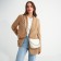 Bag Women's Cross-Bodi with a zipper, milk color