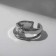 Ring "melting" double, white color in silver, dimensionless