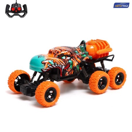 Radio -controlled jeep Monster, 1:16, Smoke effect, light effects, works on the battery, Orange color