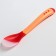 A spoon for feeding, thermal sensitive, red-beige color
