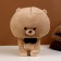 Soft toy "Dog" with a butterfly, 22 cm, beige color