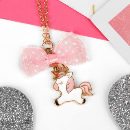 Children's pendant "chosen" unicorn with a bow, white-pink color in gold