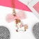 Children's pendant "chosen" unicorn with a bow, white-pink color in gold