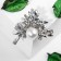 Brooch "Pearls" olive leaves, white color in silver