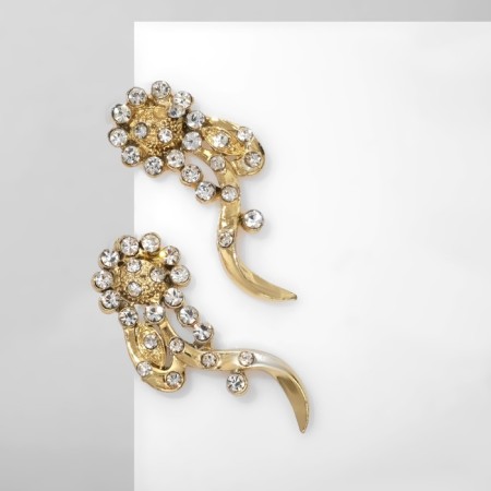Earrings with rhinestones "flowers" bends, white color in gold-1