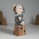 Souvenir Ceramics Light "Baby in a gray coat, with a penguin on the gift" 12x6.5x20 cm